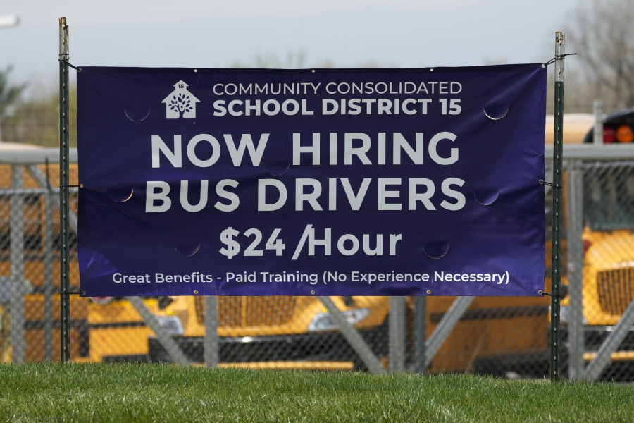 File - A hiring sign seeking bus drivers is posted in Palatine, Ill., Wednesday, April 19, 2023. On Thursday, the Labor Department reports on the number of people who applied for unemployment benefits last week. (AP Photo/Nam Y.