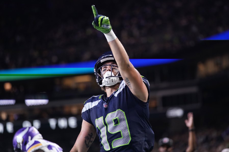 Seattle Seahawks wide receiver Jake Bobo celebrates after scoring against the Minnesota Vikings during the second half of an NFL preseason football game in Seattle, Thursday, Aug. 10, 2023.