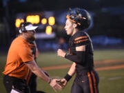 Washougal's Holden Bea is congratulated after scoring a touchdown against River Ridge at Fishback Stadium in Washougal on Thursday, Aug. 31, 2023.