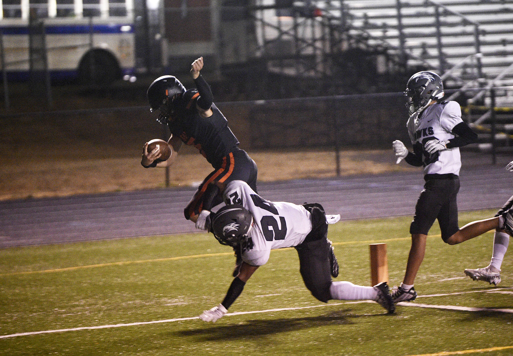 Washougal's Holden Bea scores a touchdown against River Ridgefield's Josiah Jackson (24) in a game at Fishback Stadium in Washougal on Thursday, Aug. 31, 2023.