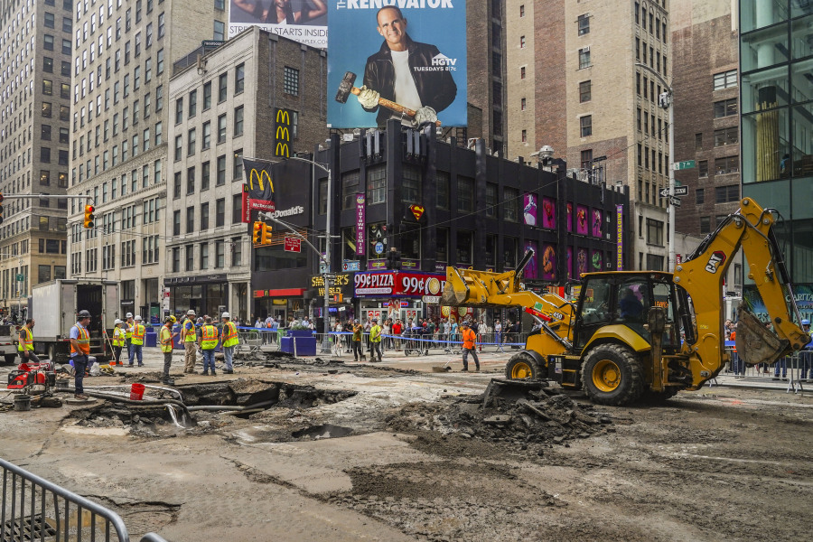 Work crews begin repair after a 127-year-old water main under New York's Times Square gave way under 40th Street and Seventh Avenue at 3 a.m., flooding streets and subways, Tuesday Aug. 29, 2023, in New York.