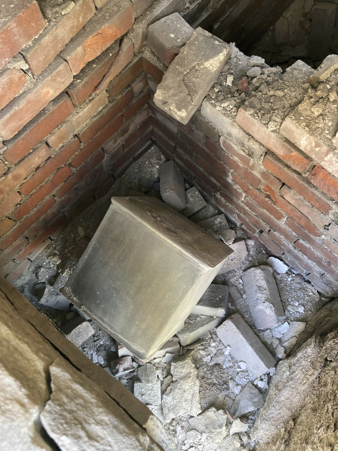 This photo provided by the U.S. Military Academy at West Point, shows a time capsule uncovered, Friday, June 9, 2023. The long-forgotten time capsule, a small lead box measuring about a cubic foot, was discovered in May 2023, during restoration to a monument honoring Revolutionary War hero Thaddeus Kosciuszko, on the grounds of West Point, in New York. The box will be opened during a livestreamed event, Monday, Aug. 28. (Christopher Hennen/U.S.