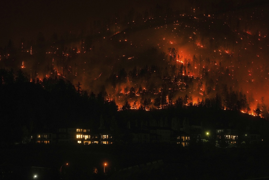 The McDougall Creek wildfire burns on the mountainside in West Kelowna, British Columbia, on Aug.18.