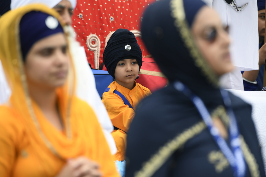 Members of the Sikh community participate in the Parliament of World Religion Parade of Faiths, Sunday, Aug. 13, 2023, in Chicago.