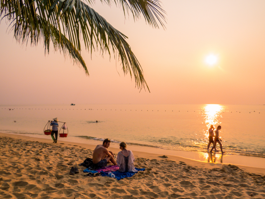 People on the popular Long Beach at sunset in Phu Quoc, Vietnam.