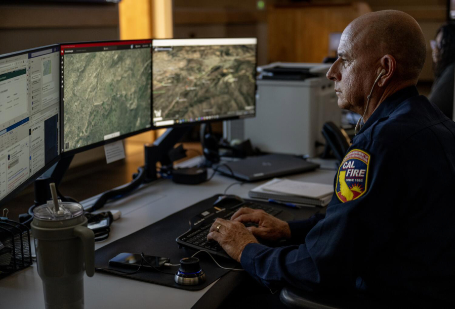 Cal Fire Ted Schaffer monitors computer screens which depicts views of wildfire camera systems in real time throughout the state of California at the Southern California Geographic Area Coordination Center on Aug. 9, 2023, in Moreno Valley, California. The agency is using AI to help monitor the camera systems.