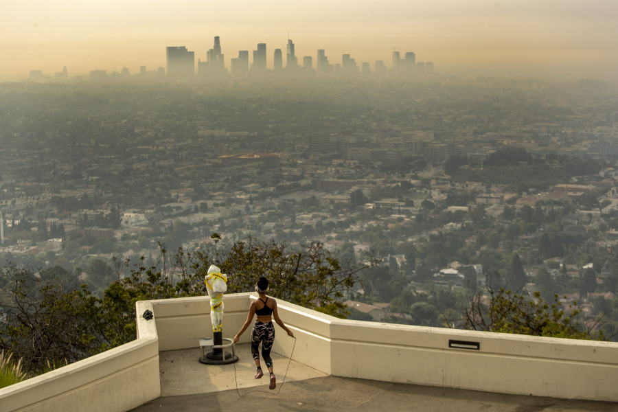 Los Angeles resident Carmen Green jumps rope at a closed Griffith Observatory in spite of dense smoke from wildfires in September 2020.