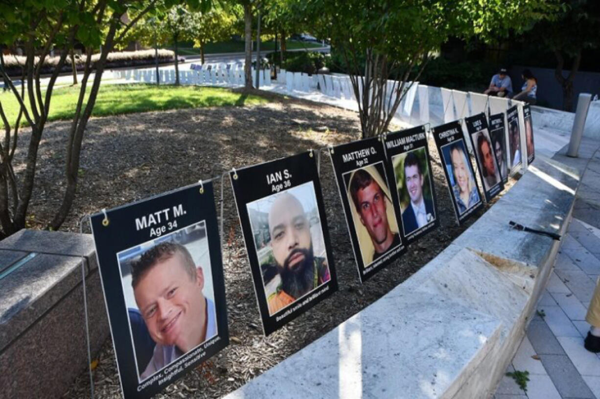 Photos of young overdose victims on display at an overdose awareness event in Rockville, Md., in August. Accidental overdose has become a primary cause of deaths for people under 40.