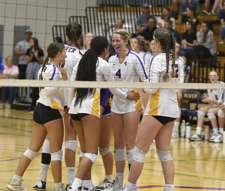 Columbia River's Sydney Dreves (4) celebrates with teammates after a point against Skyview on Wednesday, Sept. 6, 2023 at Columbia River High School.