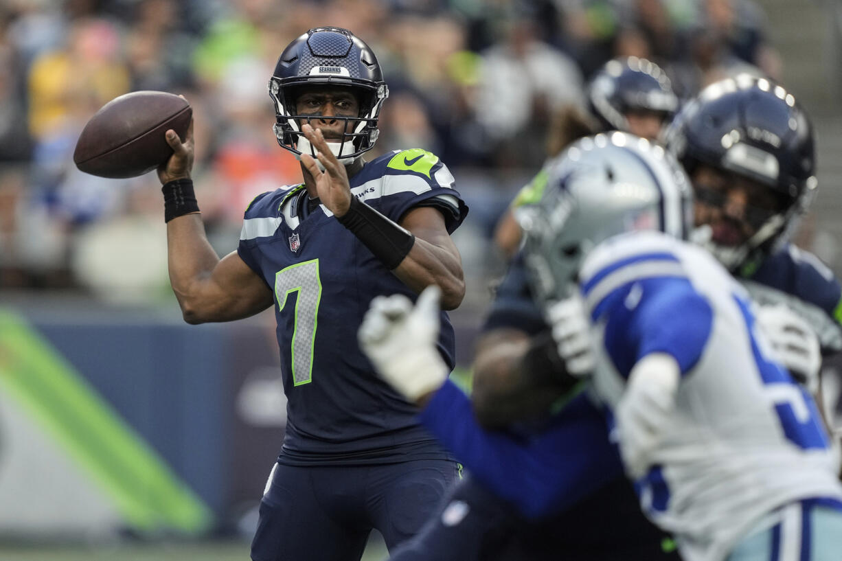 Seattle Seahawks quarterback Geno Smith passes the ball during an NFL preseason football game against the Dallas Cowboys, Saturday, Aug. 19, 2023, in Seattle. The Seahawks won 22-14.