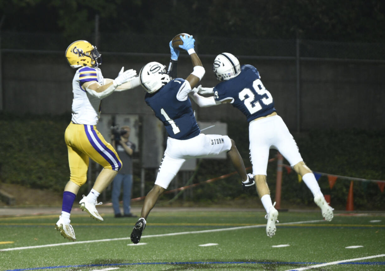 Skyview's Riley Artis (1) makes an interception in the first quarter during the Storm's 49-0 win over Columbia River on Friday at Kiggins Bowl.