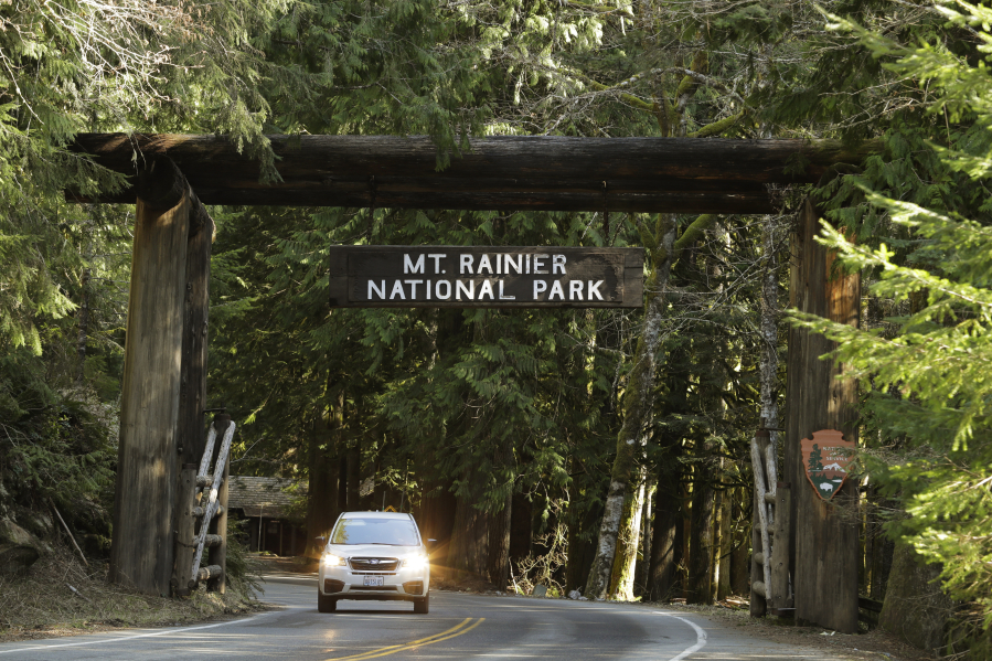 A car passes through the entrance to Mount Rainier National Park on March 18, 2020. (Ted S.
