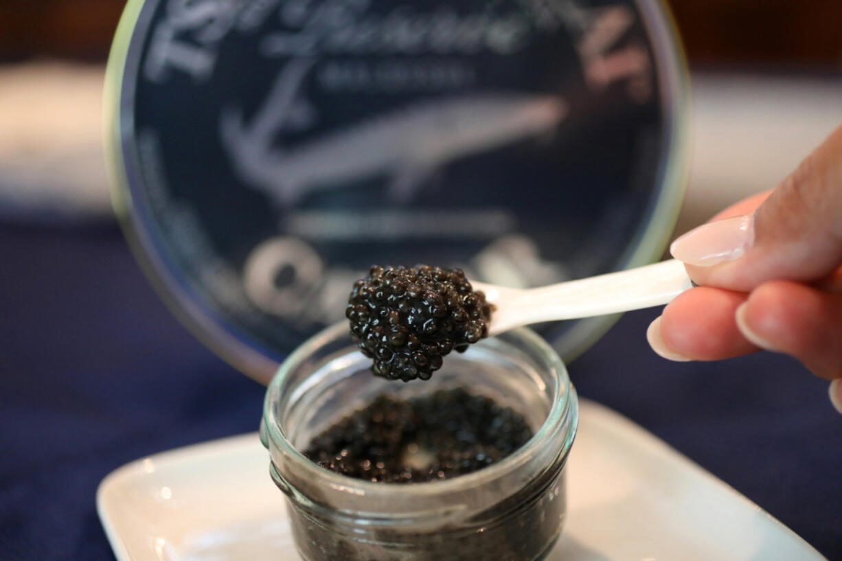 A spoonful of white sturgeon caviar from Tsar Nicoulai Caviar at the company's aquafarm in Wilton, Calif.