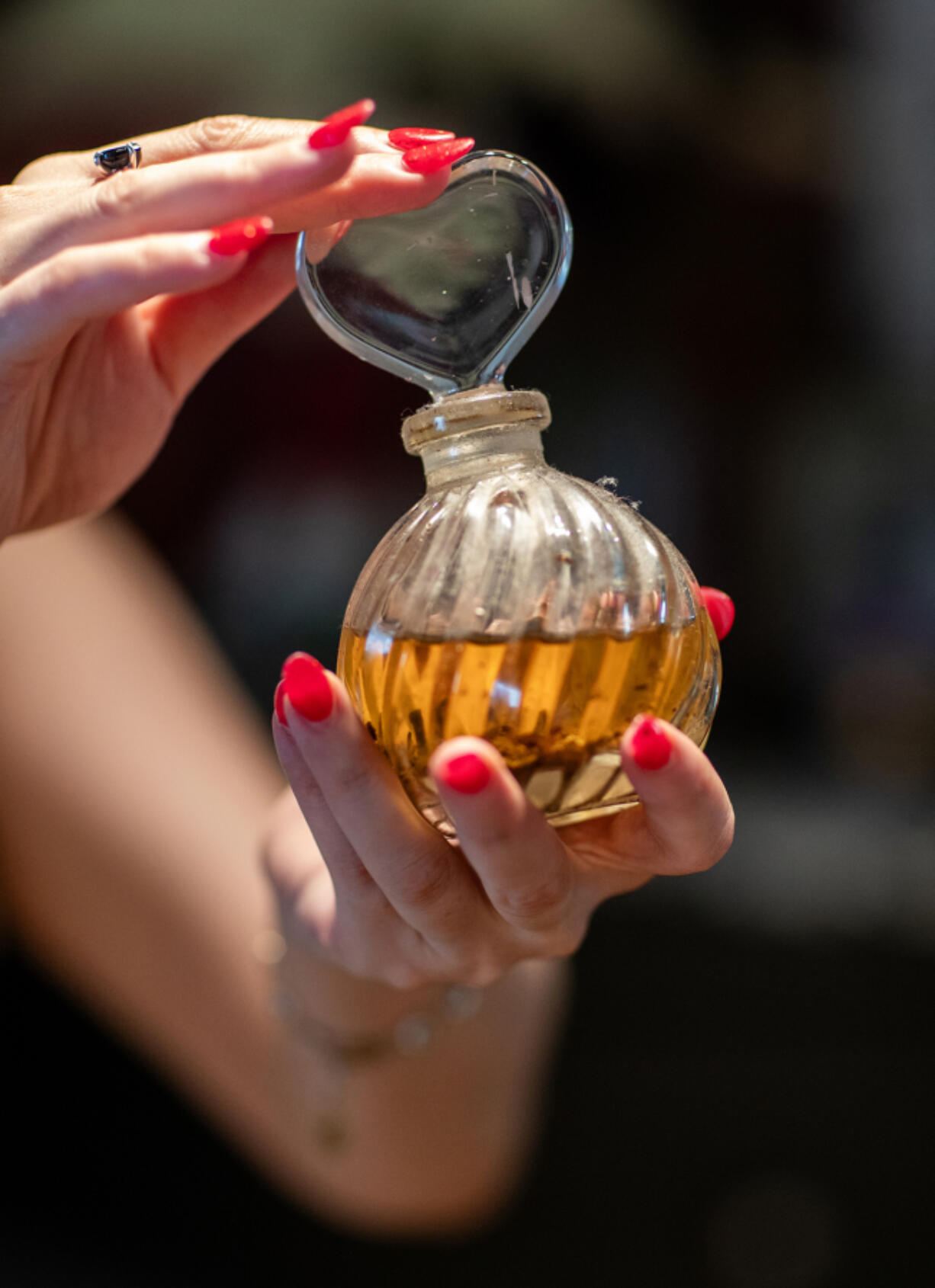 A vial of oil that Gogo Akopyan uses to anoint the candles she places on her deities??? altars. (Allen J. Schaben/Los Angeles Times/TNS) (Photos by Allen J.
