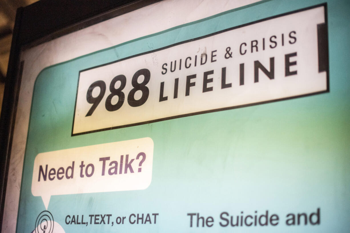 An advertisement for the Suicide & Crisis Lifeline's 988 hotline is seen at the Shaw-Howard University subway station in Washington, D.C.
