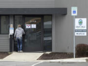 A woman enters the Great Circle drug treatment center in Salem, Ore., on March 8, 2022. Three years ago, Oregonians voted to decriminalize drugs and dedicate hundreds of millions of dollars to treatment services, but the state's first-in-the-nation drug decriminalization has had a rocky start.