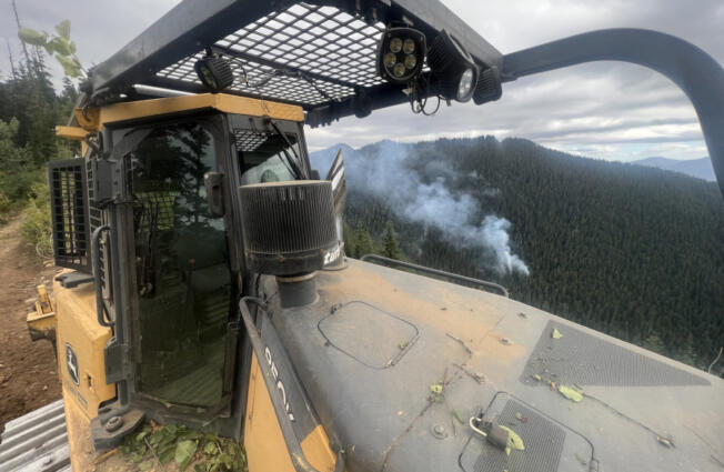 Crews are creating contingency lines around fires in the Gifford Pinchot National Forest to act as a safety net in case they grow, something fire managers say is unlikely thanks to cool, wet weather.