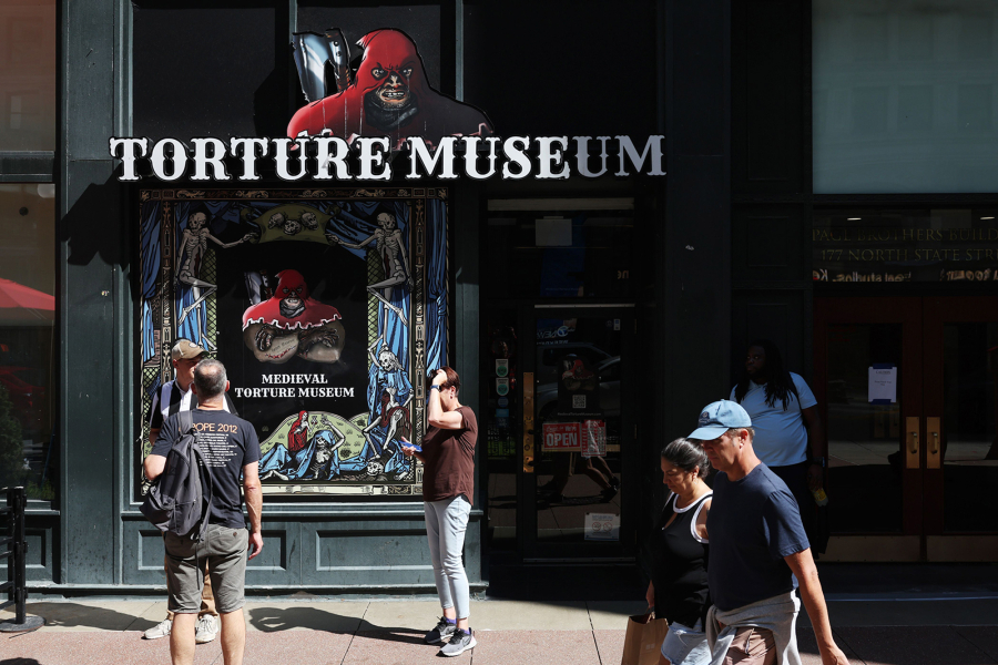 Visitors exit the Medieval Torture Museum in Chicago on Sept. 13. (John J.