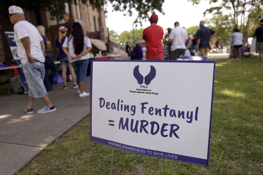 A sign equates fentanyl poisoning as murder during an Association of People Against Lethal Drugs rally outside the old Tarrant County Courthouse on May 6, 2023, in Fort Worth, Texas.
