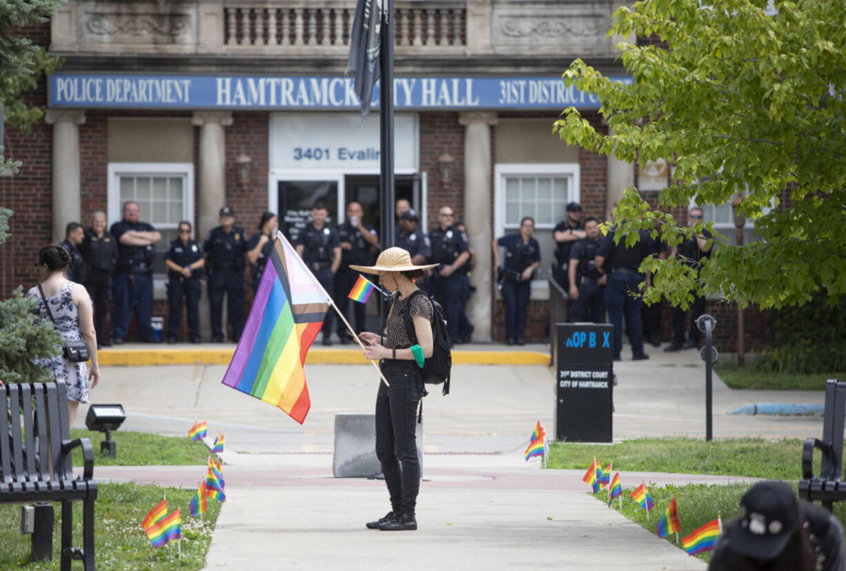 Protesters opposing the City of Hamtramck's recent resolution banning the flying of LGBTQ+ flags, political flags, and flags symbolizing any race or religion on City property, demonstrate at City Hall on June 24, 2023, in Hamtramck, Michigan.