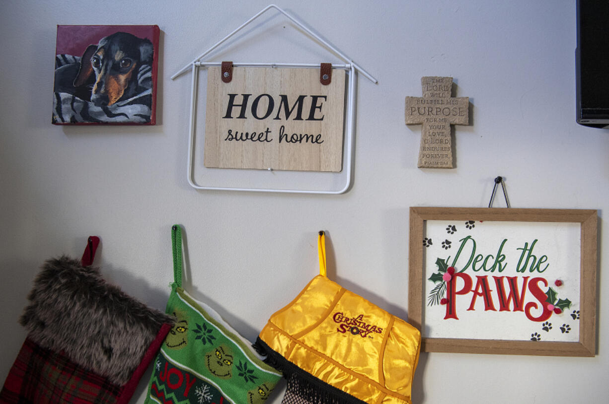 An assortment of wall hangings and Christmas decorations are seen in Sabrina and James Thayer's tiny home in Vancouver.