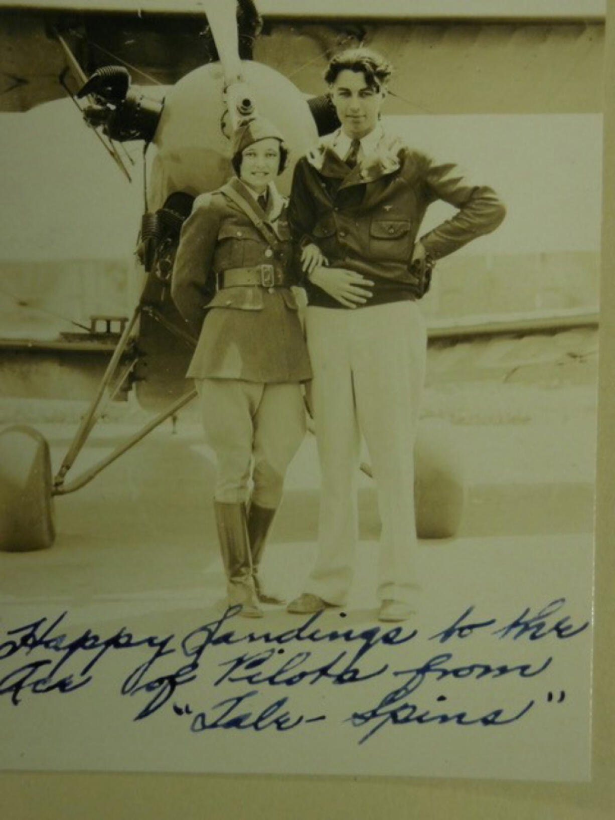 Walt Bohrer and his sister Ann appear above handwriting on a photo addressed the "Ace of Pilots," a phrase they often used in their communications with fliers. The "ace" might refer to Eddie Rickenbacker, a friend, or some other "war ace." Tale Spins was a magazine the Bohrers produced. Although the two siblings' careers meshed, they did go separate ways. Ann is in her "air hostess" uniform, and Walt was a close friend of stunt pilot Tex Rankin and spent 22 years working with him.