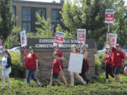 Evergreen Education Association members took a break from picketing outside their respective school locations to rally outside the Evergreen Public Schools district office Friday afternoon. Friday is the third day schools have been closed amid stalled contract negotiations with Evergreen teachers.