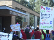 Students and parents converged outside the Evergreen Public Schools district office Friday afternoon to express support for striking teachers. A parent group on Facebook supporting teachers, who have been on strike since Aug. 30 amid stalled contract negotiations with the district, added over 1,400 members since its creation Wednesday.
