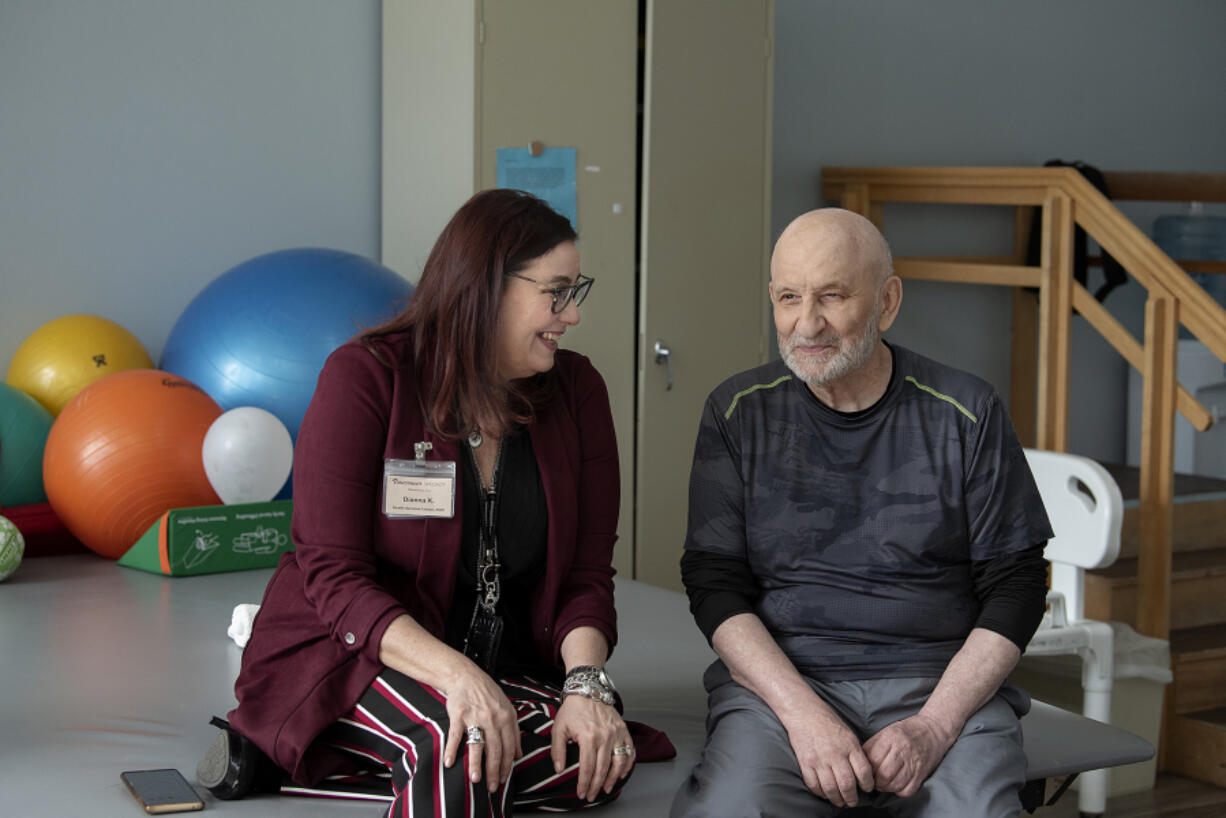 Health services liaison Dianna Kretzschmar, left, chats with Vancouver Specialty and Rehabilitative Care resident Chris Muntean.