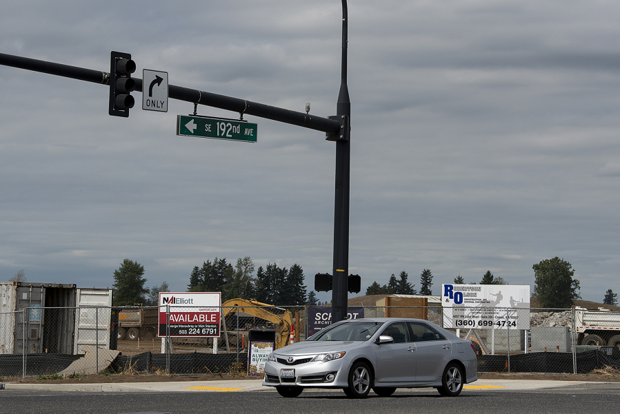A motorist passes by a development underway at Lacamas Square in southeast Vancouver. The retail center will include four buildings in its first phase, bringing in around 38,000 square feet of new retail space to the corner of N.E. 192nd Avenue and S.E. First Street.