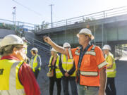 Interstate 5 Bridge Supervisor Marc Gross, right, talks about the inner workings of the bridge during a tour Thursday during a meeting of the Washington State Transportation Commission.
