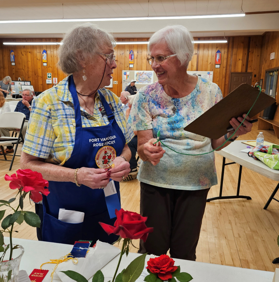 Members and guests at the Sept. 7 meeting of the Fort Vancouver Rose Society celebrated the 70th anniversary of the organization.