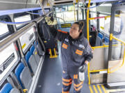 Gaby Soltero of C-Tran cleans a Fourth Plain Vine bus Wednesday at the VanMall Transit Center. A study conducted by the University of Washington released earlier this month found small amounts of methamphetamine, fentanyl and cocaine were traceable on buses and trains operated by large transit agencies in Washington and Oregon.