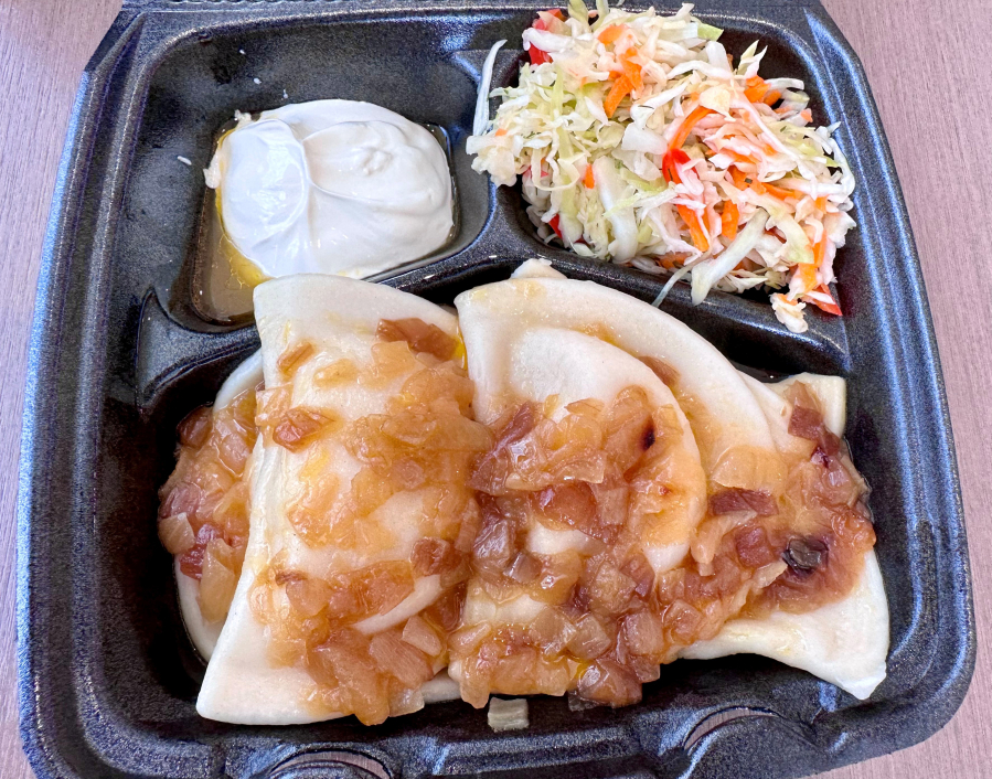 Ukrainian food stall Banderyky at Vancouver Mall's food court serves varenyky, dumplings filled with potato and cheddar cheese, and topped with caramelized onion, sour cream.