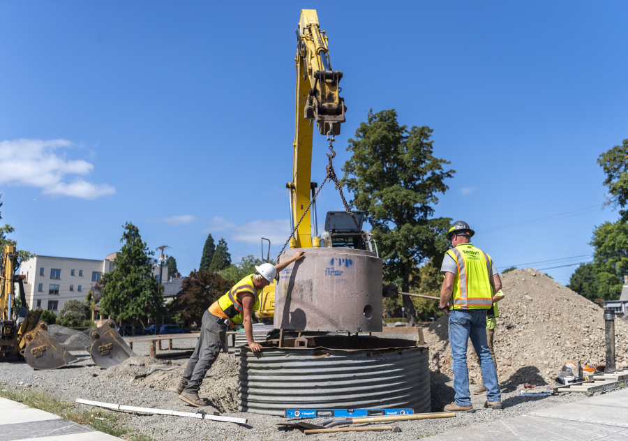 Workers from Ridgefield-based City Electric Co. started construction of the downtown Safe Stay community on Monday by excavating a space for a large utility cylinder.