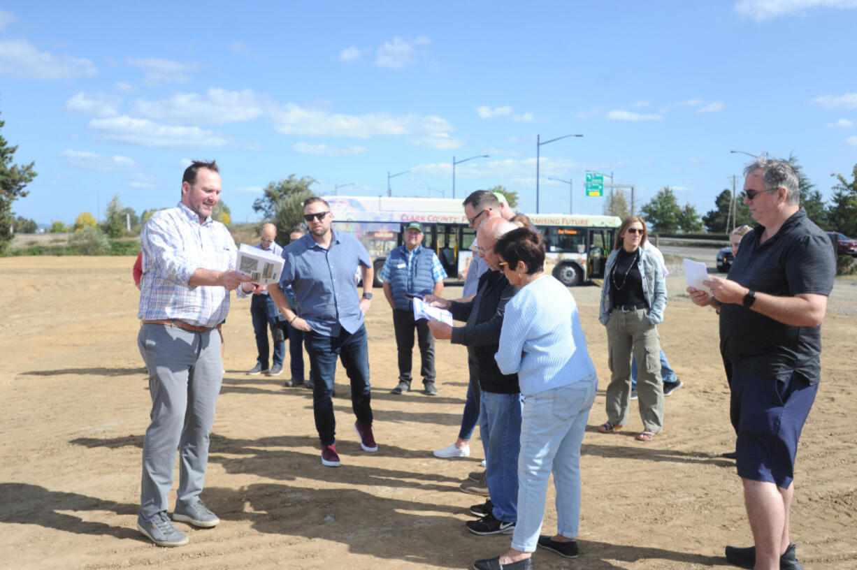 Ridgefield City Manager Steve Stuart discusses new businesses coming to Union Ridge Town Center near Interstate 5 with city council, planning commission and parks board members during a development tour Monday afternoon.