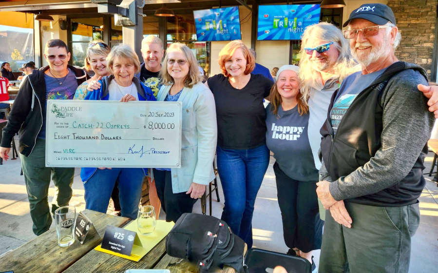 The dragon boat charity organization Paddle For Life recently presented the Catch-22 Breast Cancer Survivors Dragon Boat Team with a $8,000 check from a fundraiser held in Ridgefield last month.