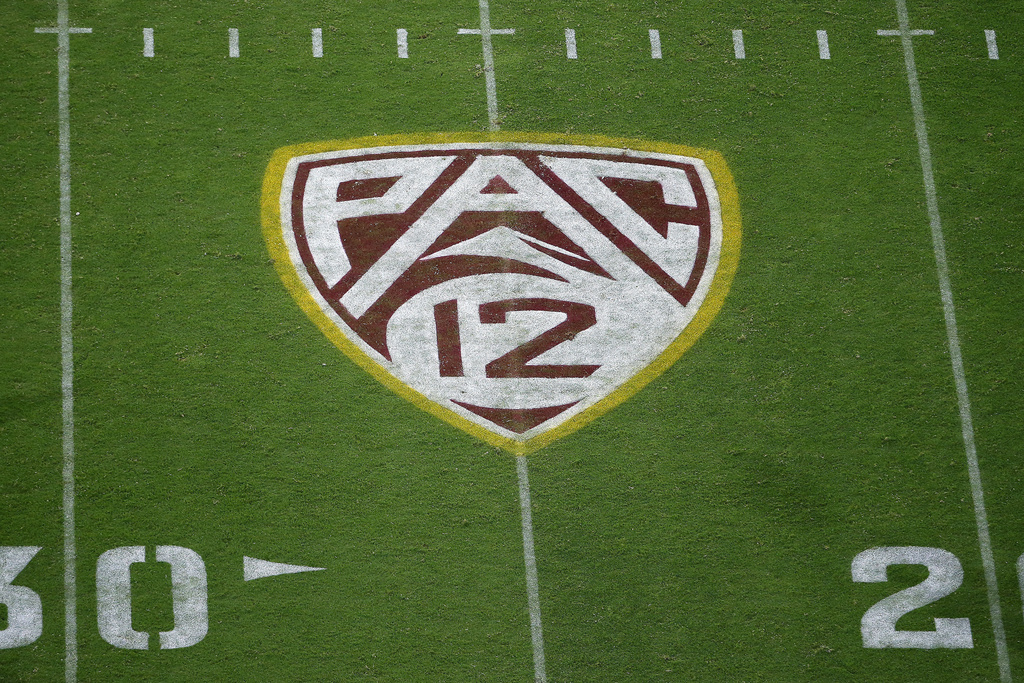 FILE - The field at Sun Devil Stadium bears a Pac-12 logo during an NCAA college football game between Arizona State and Kent State in Tempe, Ariz., Aug. 29, 2019. The Atlantic Coast Conference has cleared the way for Stanford, California and SMU to join the league, two people with direct knowledge of the decision told The Associated Press on Friday, Sept. 1, 2023, providing a landing spot for two more teams from the disintegrating Pac-12.