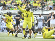Oregon defensive end Brandon Dorlus (3) celebrates a stop against Portland State during the first half of an NCAA college football game Saturday, Sept. 2, 2023, in Eugene, Ore.