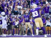Washington tight end Jack Westover reacts after scoring a touchdown against Boise State safety Rodney Robinson (4) during the first half of an NCAA college football game, Saturday, Sept. 2, 2023, in Seattle.