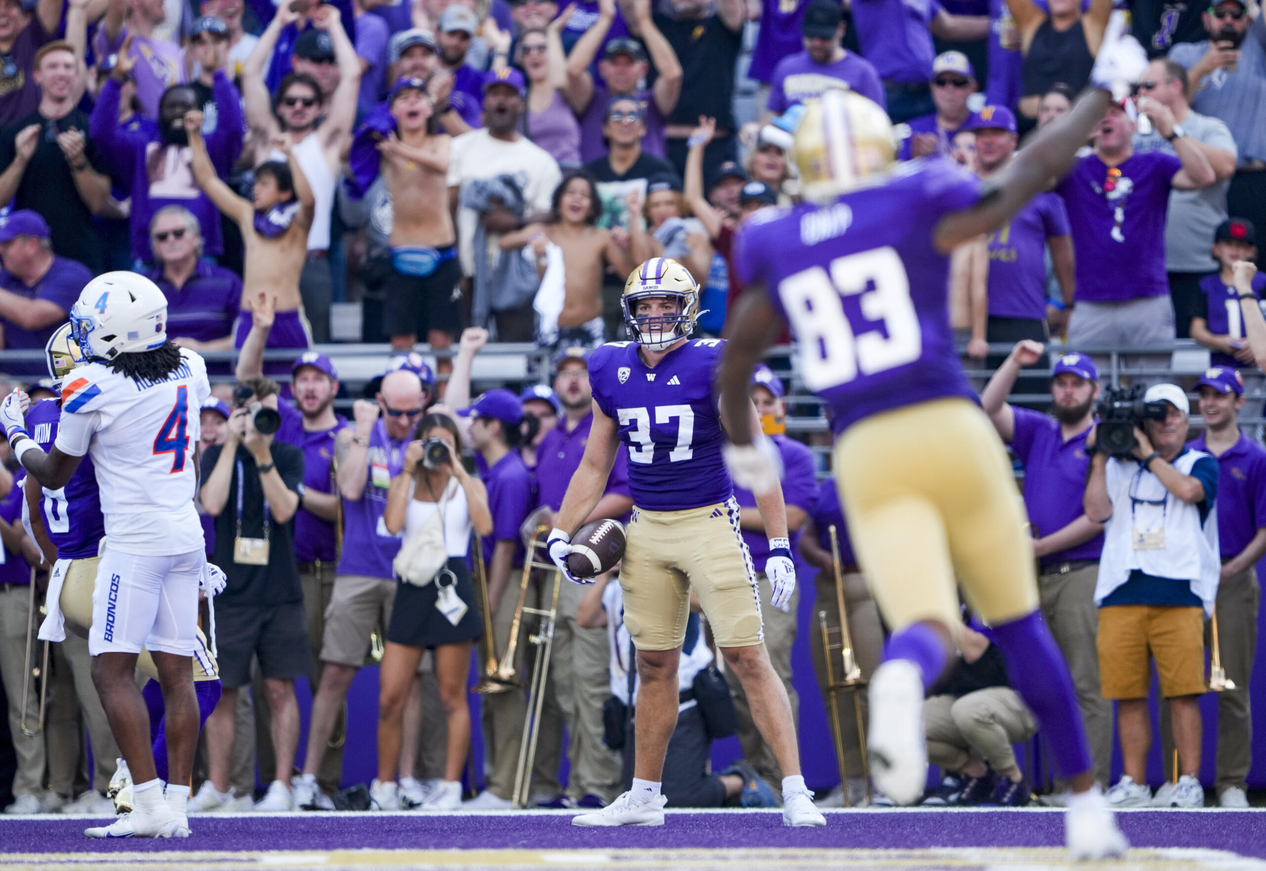 Washington tight end Jack Westover reacts after scoring a touchdown against Boise State safety Rodney Robinson (4) during the first half of an NCAA college football game, Saturday, Sept. 2, 2023, in Seattle.