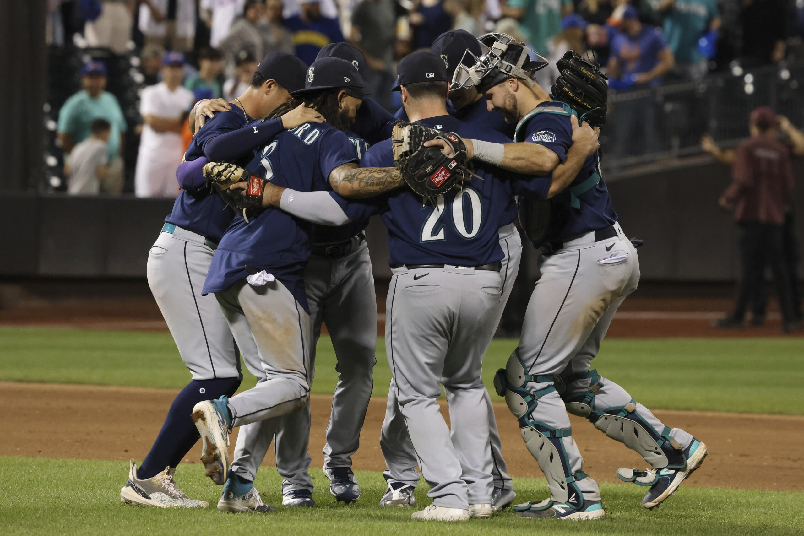 Seattle Mariners players celebrate after defeating the New York Mets in a baseball game, Saturday, Sept. 2, 2023, in New York.