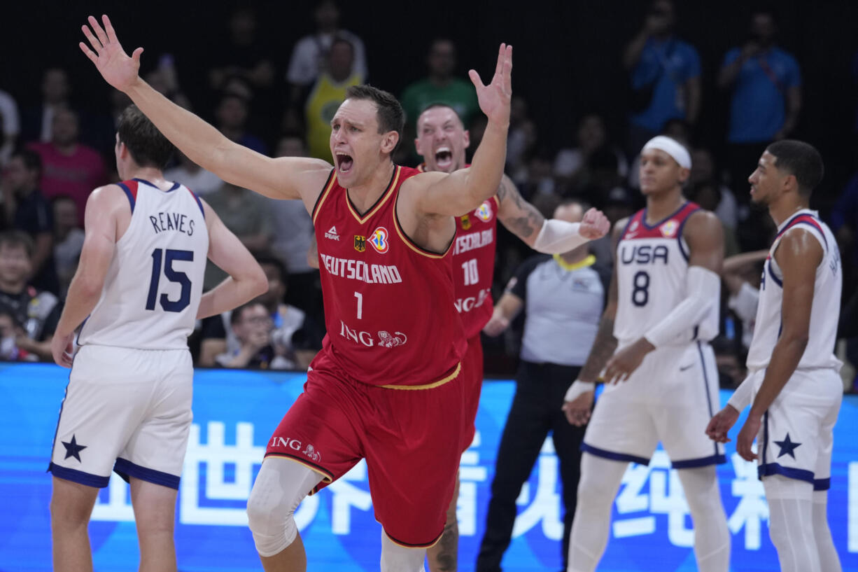 Germany center Johannes Voigtmann celebrates after winning against the United States in a Basketball World Cup semi final game in Manila, Philippines, Friday, Sept. 8, 2023.