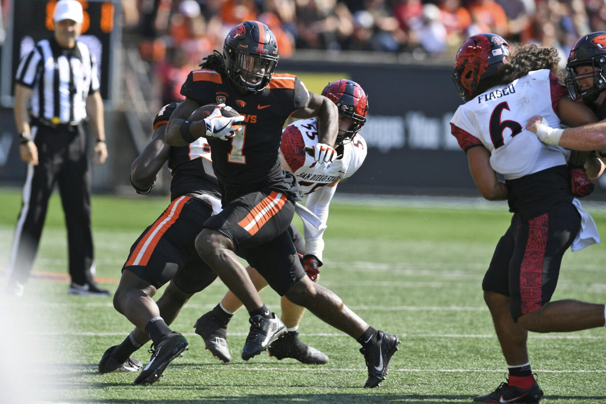 Oregon State running back Deshaun Fenwick (1) rushes during the second half of an NCAA college football game against San Diego State, Saturday, Sept. 16, 2023, in Corvallis, Ore.