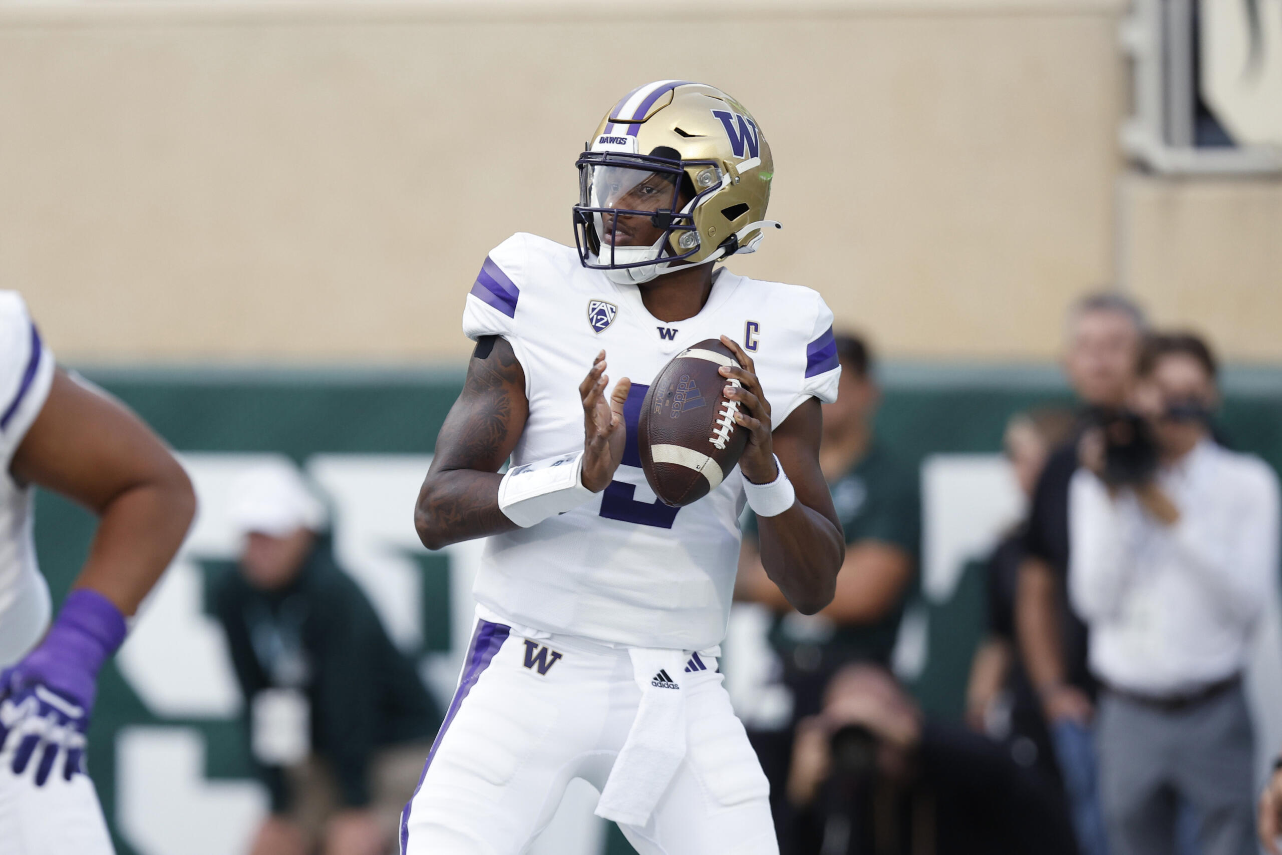 Washington quarterback Michael Penix Jr. looks to throw during the first half of an NCAA college football game against Michigan State, Saturday, Sept. 16, 2023, in East Lansing, Mich.