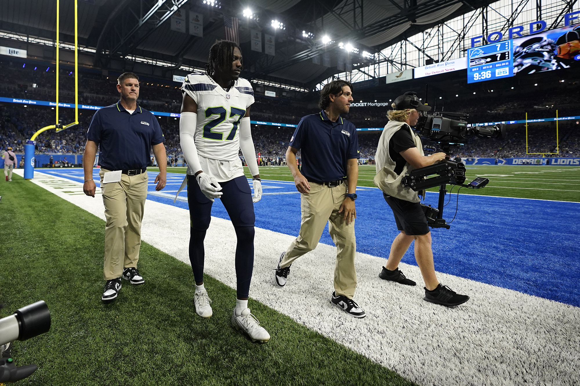 Seattle Seahawks cornerback Riq Woolen (27) walks to the locker room after getting injured during the first half of an NFL football game against the Detroit Lions, Sunday, Sept. 17, 2023, in Detroit.
