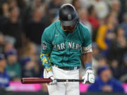 Seattle Mariners' Julio Rodríguez reacts as he flies out against the Texas Rangers during the fifth inning of a baseball game, Saturday, Sept. 30, 2023, in Seattle.