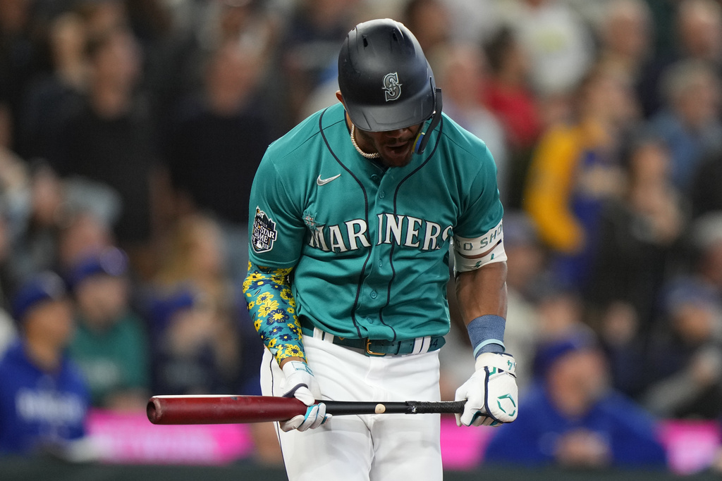 Seattle Mariners' Julio Rodríguez reacts as he flies out against the Texas Rangers during the fifth inning of a baseball game, Saturday, Sept. 30, 2023, in Seattle.