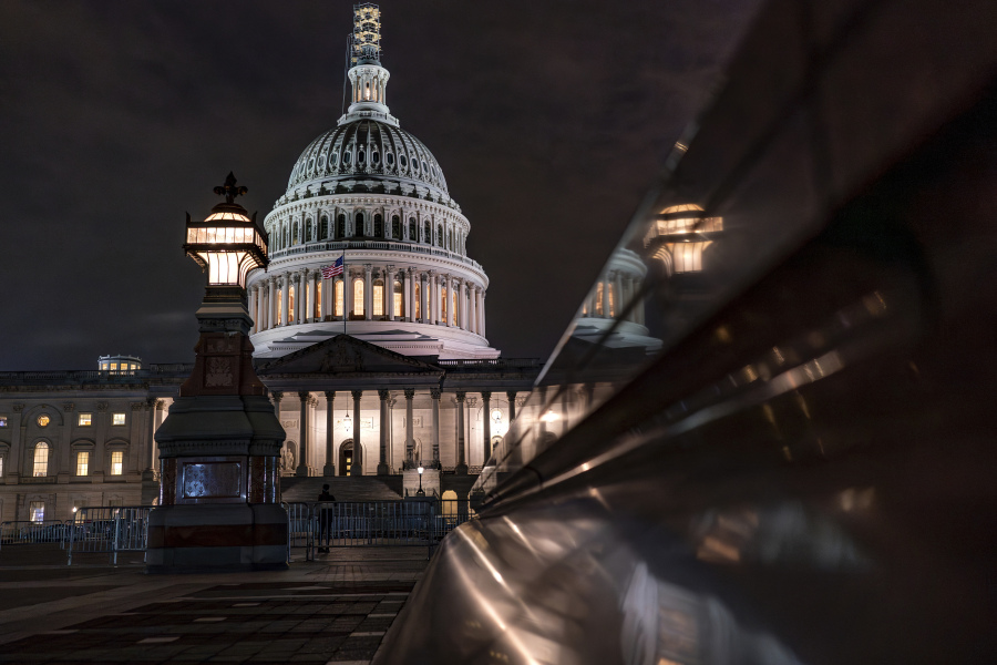 The Capitol is seen late Tuesday night, Sept. 26, 2023, in Washington, as lawmakers work to advance appropriations bills on the House floor. The Republican-controlled House and the Democrat-controlled Senate are starkly divided over very different paths to preventing a federal shutdown. (AP Photo/J.