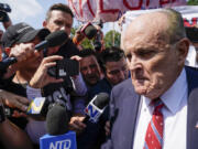 Rudy Giuliani speaks outside the Fulton County jail, Wednesday, Aug. 23, 2023, in Atlanta. Giuliani has surrendered to authorities in Georgia to face an indictment alleging he acted as former President Donald Trump's chief co-conspirator in a plot to subvert the 2020 election.